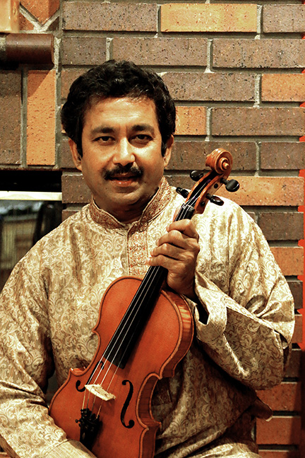 Purnaprajna Bangere holding violins